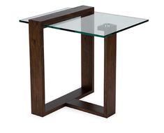 a glass and wood end table with one leg bent to the side, on an isolated white background