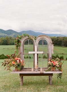 a wooden bench with flowers on it and the words charming outdoor alter - beautiful and rustic