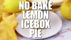 no bake lemon icebox pie on a white plate with two lemons next to it