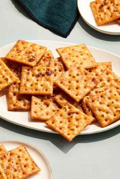 some crackers are sitting on a white plate