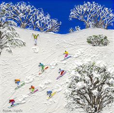 several skiers are skiing down a snowy hill