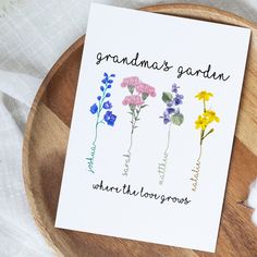 a card with three flowers on it and the words grandma's garden written in cursive writing