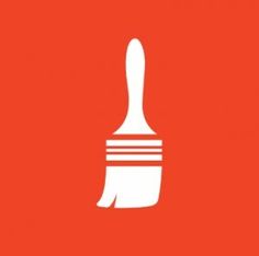 a white paint brush on an orange background