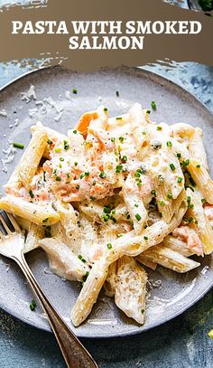 a plate filled with pasta covered in sauce and garnished with parsley on top