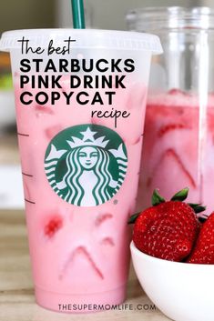 starbucks pink drink with strawberries on the side