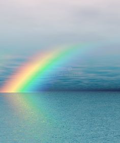 a rainbow over the ocean on a cloudy day royalty images and clippings for photoshopped