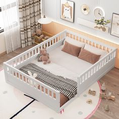 a baby's room with a white crib and teddy bears on the floor