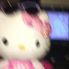 a hello kitty stuffed animal sitting on top of a table