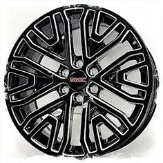 an image of a black wheel cover with chrome spokes on the front and side