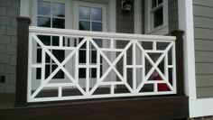 a white railing on the outside of a house