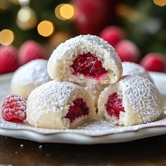 raspberry snowball cookies stacked on top of each other