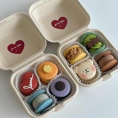 three trays filled with different types of donuts