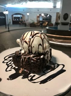 a piece of chocolate cake with ice cream on top