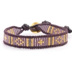 a purple and yellow bracelet with gold accents