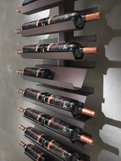 a wall mounted wine rack with many bottles