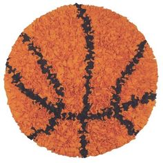 an orange rug with black stripes and a basketball on it's center, in the shape of a tree