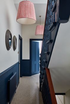 the hallway is decorated in blue and white