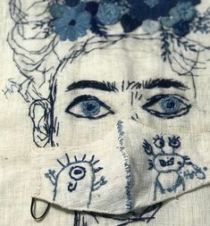 a close up of a face on a piece of cloth