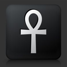 an egyptian symbol on a black square button