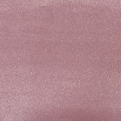 a close up view of a pink glitter texture wallpaper with no pattern on it