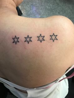 a woman's back with five stars on it