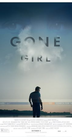 the movie poster for gone girl with a man standing in front of water and clouds