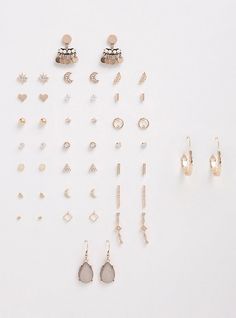 You're literally never going to run out of cute earrings again now that you have this set. With 24 pairs, all in gold tone metal, the designs vary from textured hoops to shimmering crescent moons. Set of 24. Base metals. Imported. The best plus size women's celestial earring set earrings sets in gold. Torrid is your destination for cozy fall and winter clothes to keep you warm and comfortable. Celestial Earring, Photographing Jewelry, Earrings Sets, Affordable Plus Size Clothing, Diamond Shape Earrings, Flat Back Earrings, Packing Jewelry, Cute Necklace, Run Out