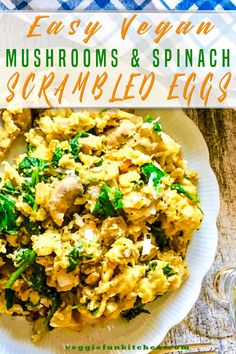 an easy vegan mushroom and spinach scrambled eggs recipe on a white plate next to a glass of water