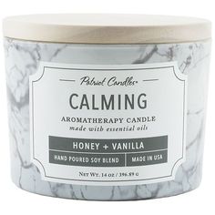 a jar of calming honey and vanilla scented candle on a white background with the label