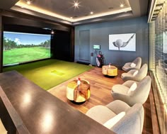 a golf simulator is set up in the middle of a room