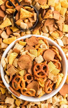 a white bowl filled with cheetos and pretzels