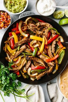 This sizzling skillet steak fajitas recipe (with the best marinade) always hits the spot for an easy, delicious, and exciting dinner! Best Steak Fajitas, Downshiftology Recipes, Flank Steak Recipes