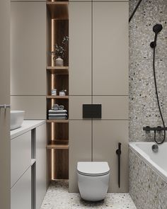 a bathroom with a toilet, sink and bathtub next to a wall mounted shower head