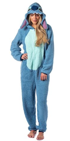 PRICES MAY VARY. OFFICIALLY LICENSED STITCH UNION SUIT: This Disney Stitch union suit is an officially licensed authentic Disney apparel DETAILED STITCH FACE DESIGN ON HOOD - One of the standout features of this one-piece pajama is the 3D puffy ears and hood with an embroidered face that replicates Stitch's iconic look. The back of the also features an embroidered "fur" patch. SUPER SOFT FAUX-SHEARLING FLEECE - This Stitch pajama union suit is made of an ultra-soft, fuzzy fleece fabric that is s Lilo And Stitch Costume, Character Eyes, Stitch Costume, Stitch Pajamas, Disney Apparel, Pajama Costume, Womens Pjs, Union Suit, Embroidered Face