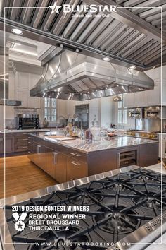 a kitchen with stainless steel appliances and wood flooring is featured on the cover of blue star magazine