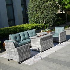 an outdoor patio furniture set with blue cushions