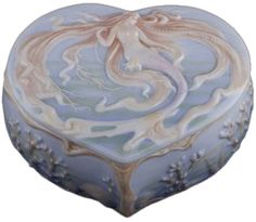 a blue and white heart shaped box with a mermaid on it