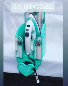 an electric iron is plugged in to a wall with the words creaciones1 on it