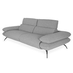 a gray couch sitting on top of a white floor