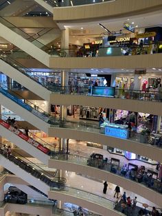 the inside of a shopping mall filled with people