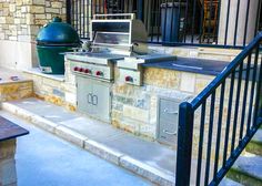 an outdoor bbq and grill on the side of a building