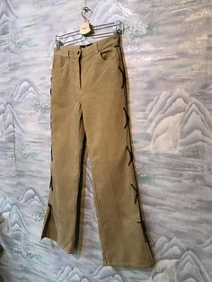 "Baggy Corduroy Pants Corduroy Trousers Boyfriend Pants Brown Sand Corduroy Pants Cowboy style pants Small Size Pants Label size: W32 ; L27 Measurements: (lying flat): Waist: 14\"- 35 cm Hips: 19\"- 48 cm Pant leg inseam: 31,5\" - 80cm Length: 41,5\" - 105 cm Please check measurements to insure a proper fit. Remember to allow yourself some extra room for movement. You can compare these with something from your closet that fits you well. This pants will come to you freshly laundered and ready to Casual Velvet Bottoms For Spring, Straight Leg Corduroy Pants For Spring, Vintage High Waist Corduroy Bottoms, Vintage Corduroy Trousers, Beige Corduroy Pants For Fall, Casual Straight Leg Velvet Pants, Casual Velvet Straight Leg Pants, Vintage Corduroy Straight Leg Bottoms, Vintage Straight Leg Corduroy Bottoms