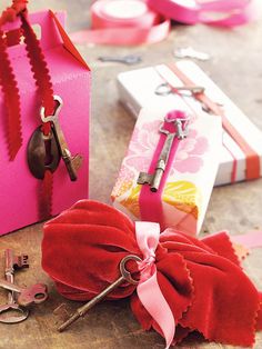 pink and red gift bags with keys on them