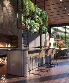 an outdoor bar with chairs and plants hanging from the ceiling, along with a fireplace