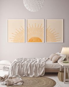 two paintings on the wall above a bed in a room with white walls and flooring