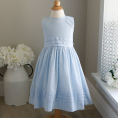 This Strasburg Pale Blue Cotton Dress In Size 2 Has Incredible Detailing. Made Of A Fine 100% Cotton Lawn, This Dress Has 3 Layers Of French Tucks At The Waistline. This Gives A Crisp Look To This Traditional Sleeveless Cotton Dress. A Tie Back Sash Ties Into A Bow For A Perfect Fit. Dress Is Fully Lined. Upper Button Back Closure. The Bonus On This Dress Is The Hand Embroidered White Floral Vines With French Knots On The Bodice Just Below The Neckline. The Pale Blue Color Is Beautiful And Subtle For Spring Or Summer. Super Classy!!! Gorgeous Dress That Has Not Been Produced In Decades-Great Find!!! May Also Fit A Size 3 Due To Strasburg's Generous Sizing (See Measurements Below For Fit) Gre French Tuck, Pale Blue Color, Sleeveless Cotton Dress, Matching Sisters, Blue Cotton Dress, French Knots, Fit Dress, 3 Layers, Dress Blue