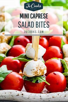 mini caprese salad bites with tomatoes and mozzarella cheese on top in a bowl