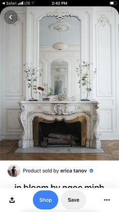 an image of a fireplace in the middle of a room with white walls and furniture