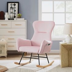 a child's rocking chair in a room with blue walls and white carpeting