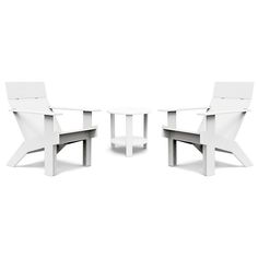 three white chairs sitting next to each other